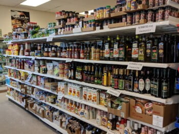 A grocery isle at Imperial Market & Deli